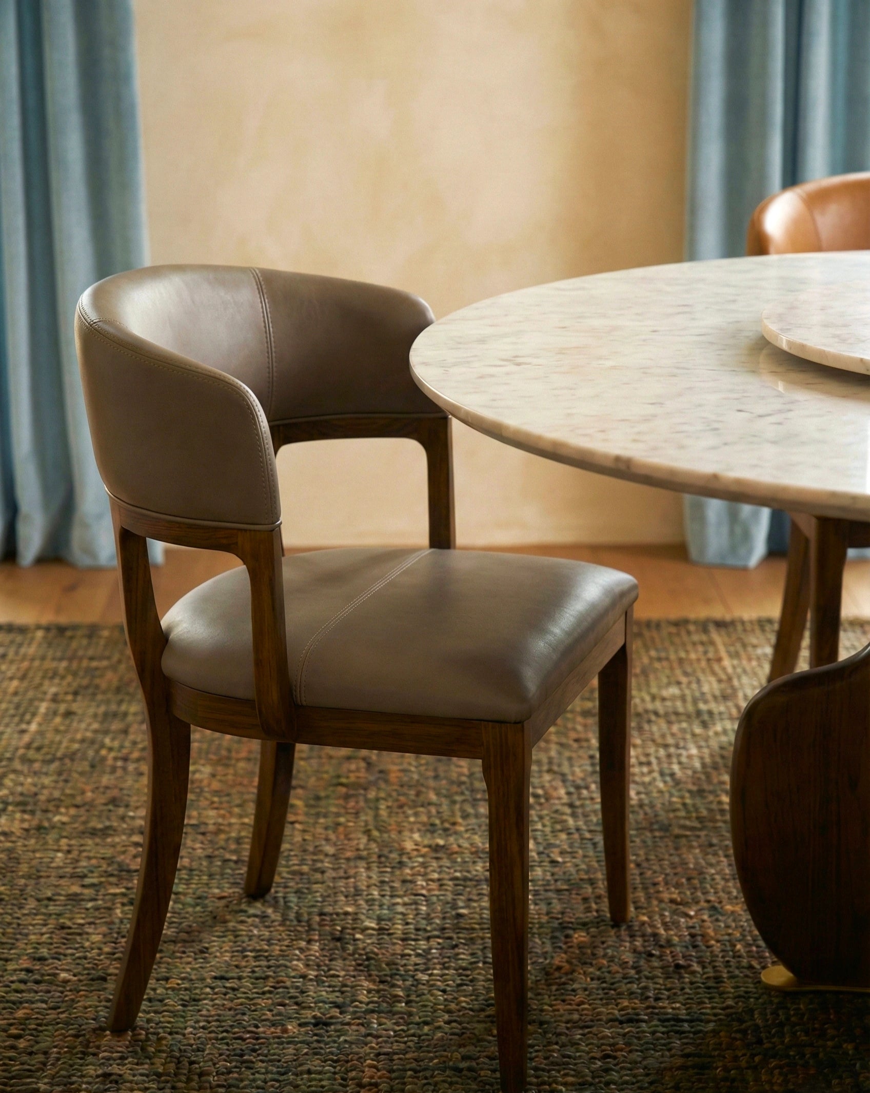 Beautiful premium round dining table with lazy susan crafted by Arris Concepts Luxury Pvt. Ltd.