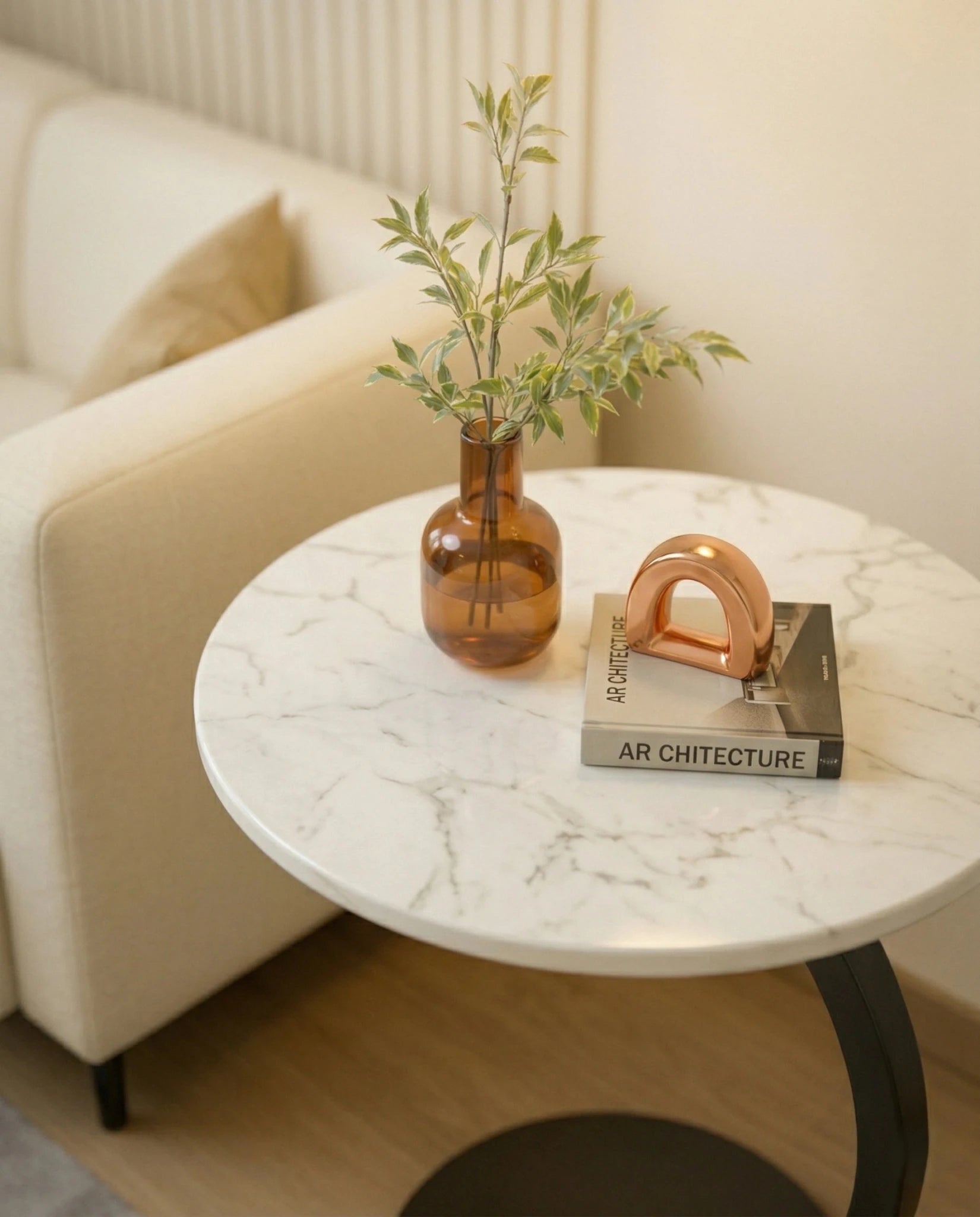 Modern stone side table and a black marble curved pedestal corner table by Arris Concepts Luxury Pvt. Ltd.