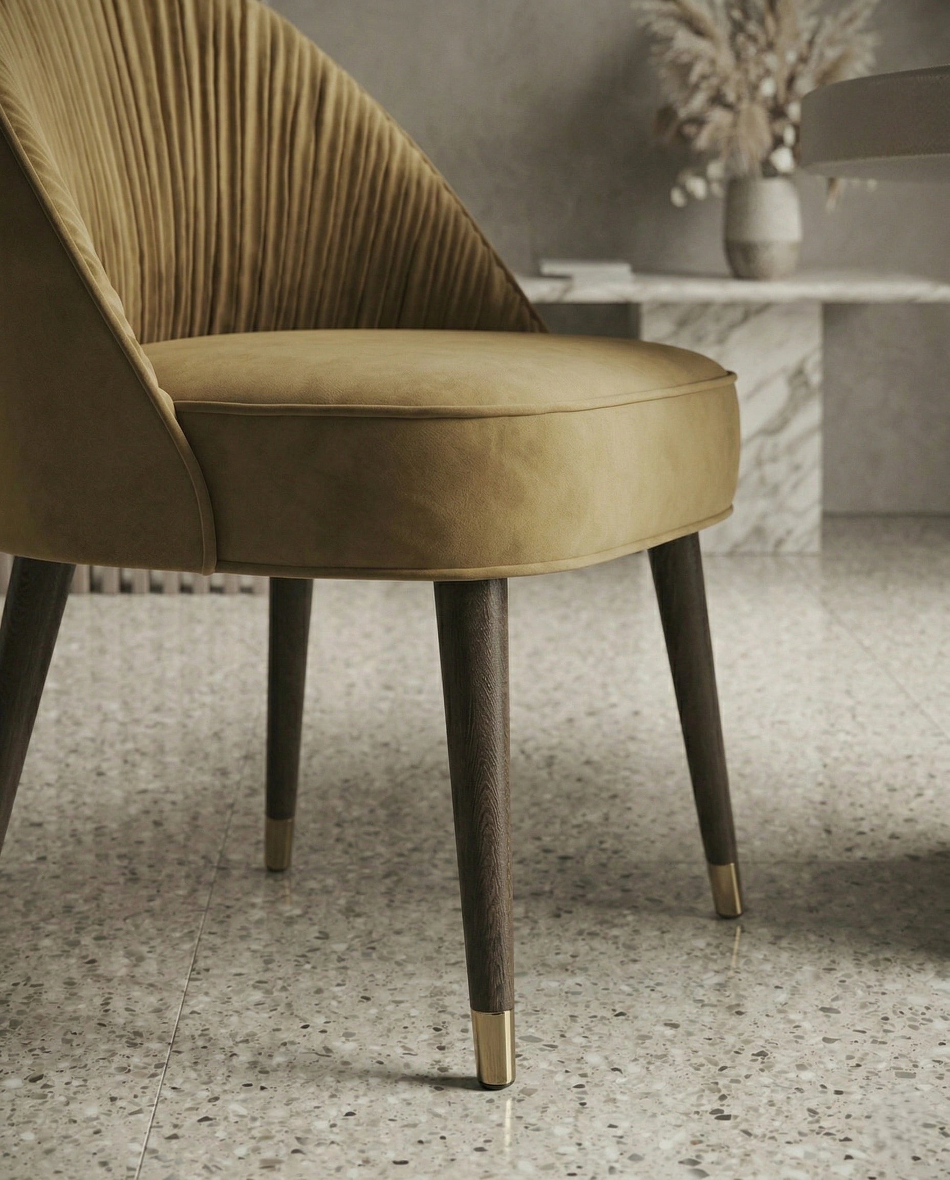 High-end designer upholstered chair and premium gold leather dining chair crafted by Arris Concepts Luxury Pvt. Ltd.