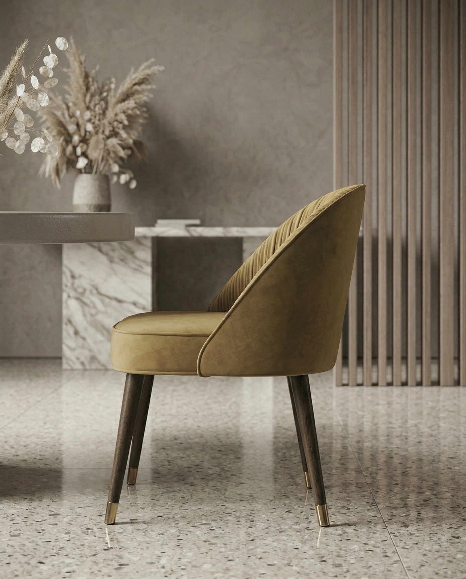 High-end designer upholstered chair and premium gold leather dining chair crafted by Arris Concepts Luxury Pvt. Ltd.