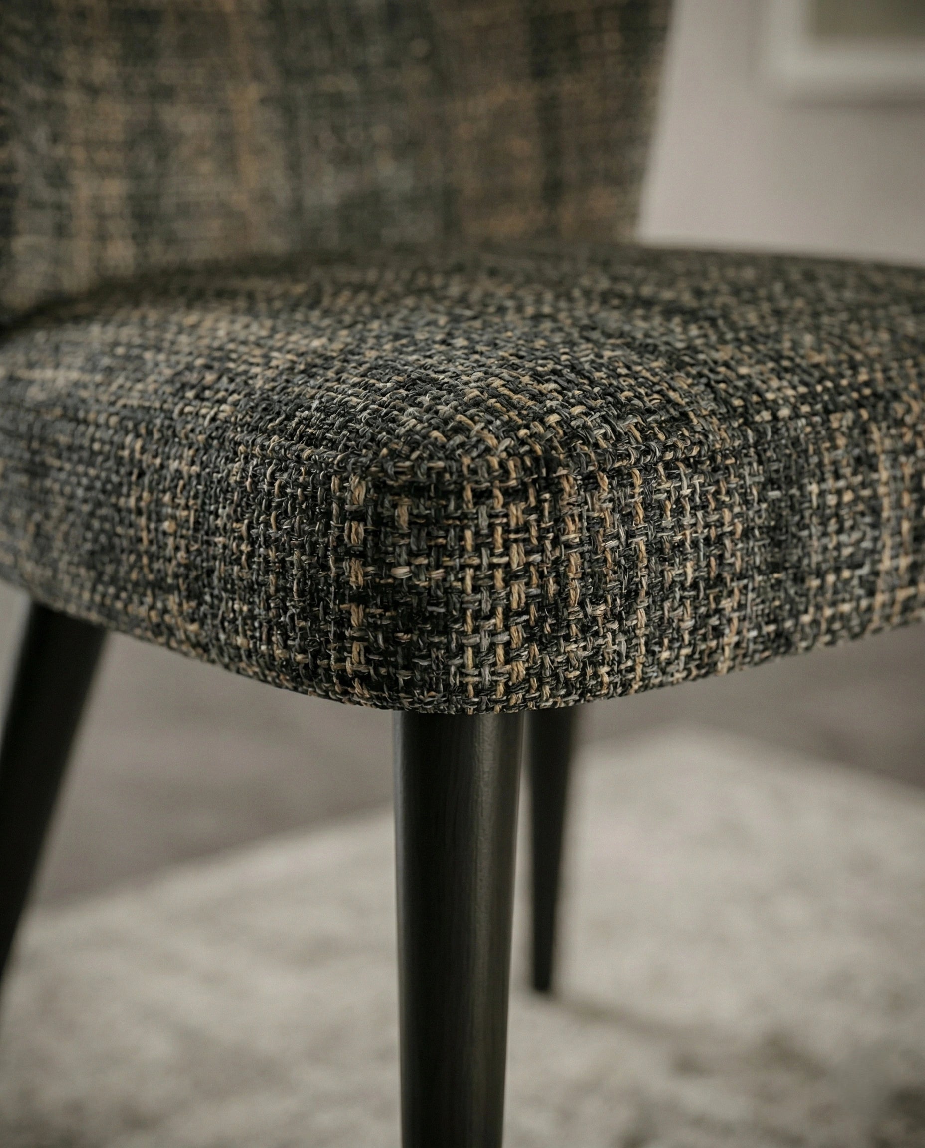 High-end fabric dining room chair and premium textured woven dining chair crafted by Arris Concepts Luxury Pvt. Ltd.