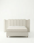 Beautiful cream fluted upholstered bed and premium extended headboard bed crafted by Arris Concepts Luxury Pvt. Ltd.