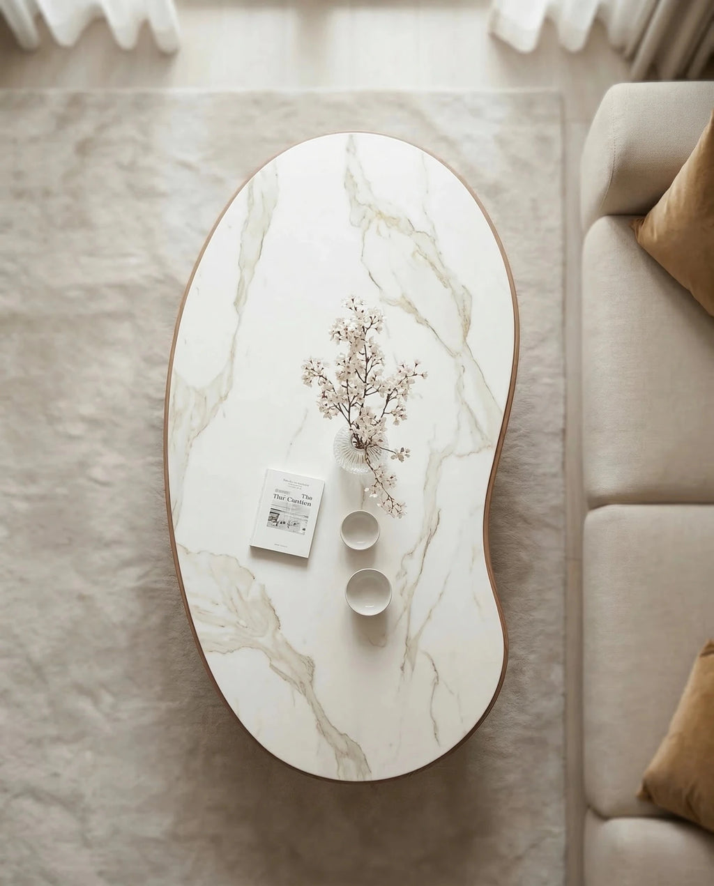 Luxury modern organic oval central table with a white stone finish by Arris Concepts