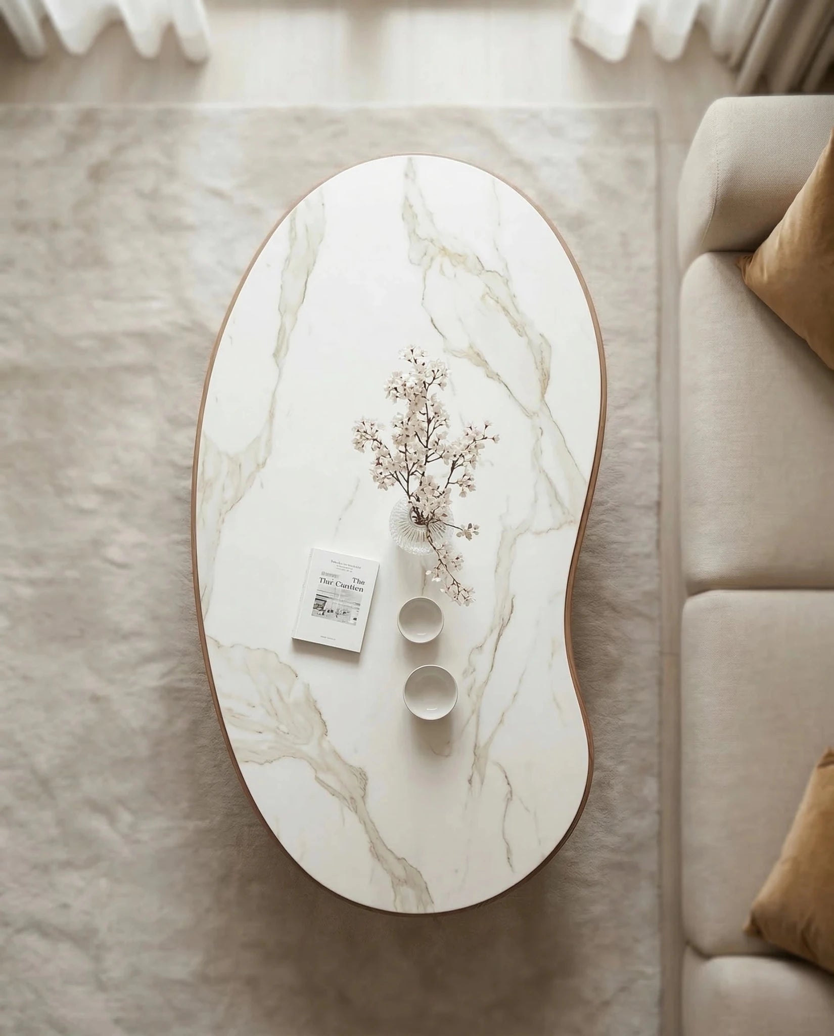 Luxury modern organic oval central table with a white stone finish by Arris Concepts