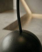 A premium asymmetrical black floor mirror with a modern irregular frame by Arris Concepts Luxury Pvt. Ltd.