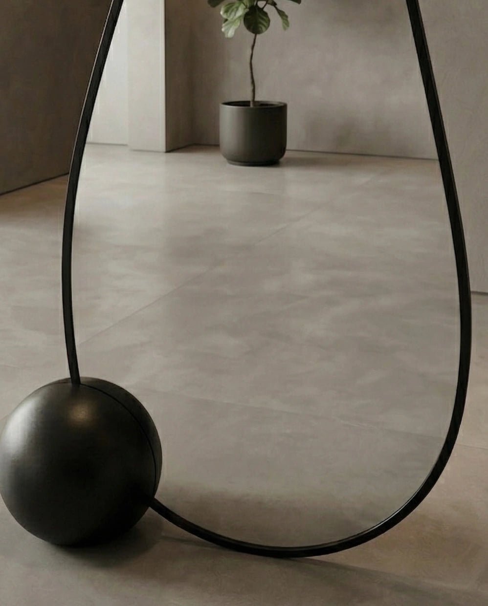 A premium asymmetrical black floor mirror with a modern irregular frame by Arris Concepts Luxury Pvt. Ltd.