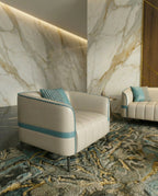 Modern curved living room seating and a premium beige channel tufted sofa crafted by Arris Concepts Luxury Pvt. Ltd.