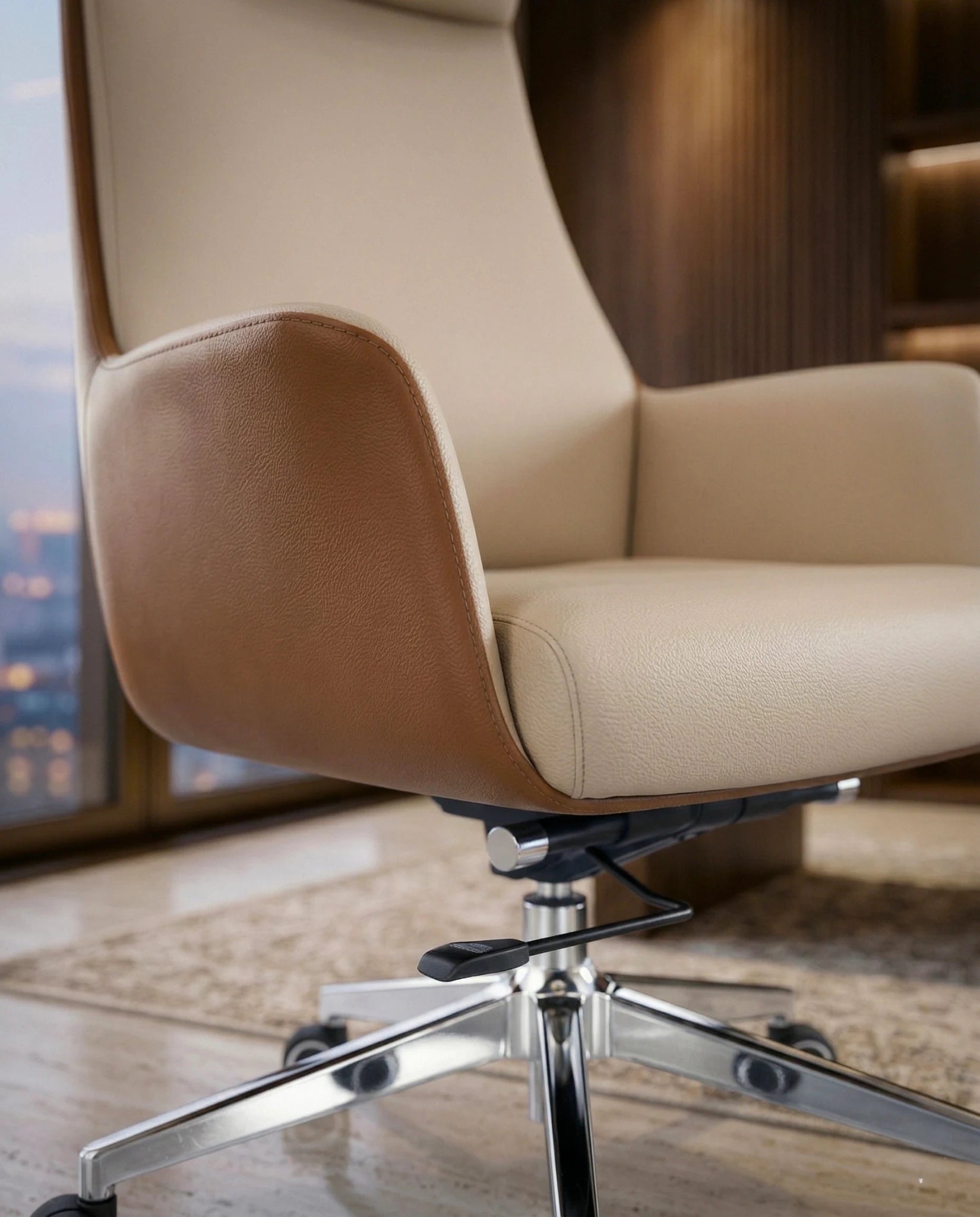 Modern ergonomic desk chair and a premium beige leather executive chair by Arris Concepts Luxury Pvt. Ltd.