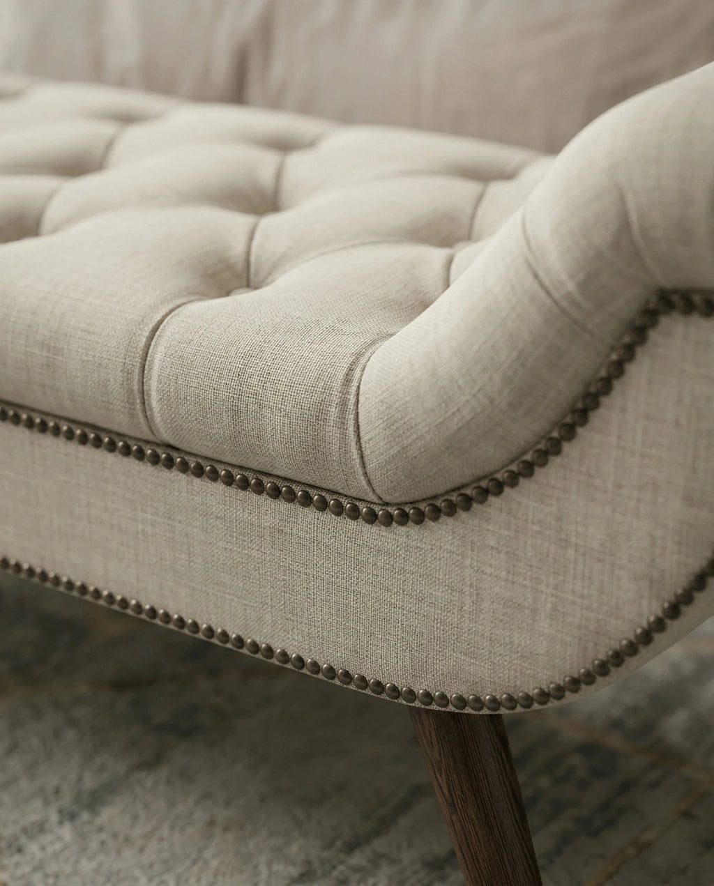 High-end foot of bed bench and premium beige tufted bed end bench crafted by Arris Concepts Luxury Pvt. Ltd.