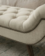 High-end foot of bed bench and premium beige tufted bed end bench crafted by Arris Concepts Luxury Pvt. Ltd.