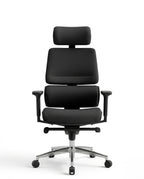 Modern desk chair with headrest and premium black ergonomic office chair by Arris Concepts Luxury Pvt. Ltd.