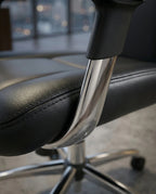 A premium black leather executive chair and designer high-back desk chair by Arris Concepts Luxury Pvt. Ltd.