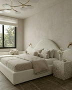 Designer upholstered floating bed and premium cream boucle platform bed by Arris Concepts Luxury Pvt. Ltd.