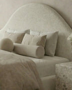Designer upholstered floating bed and premium cream boucle platform bed by Arris Concepts Luxury Pvt. Ltd.