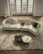 Beautiful premium curved boucle sofa with wood table crafted by Arris Concepts Luxury Pvt. Ltd.