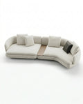 Beautiful premium curved boucle sofa with wood table crafted by Arris Concepts Luxury Pvt. Ltd.