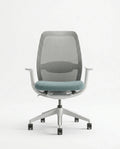 Modern desk chair with teal seat and premium ergonomic mesh office chair by Arris Concepts Luxury Pvt. Ltd.