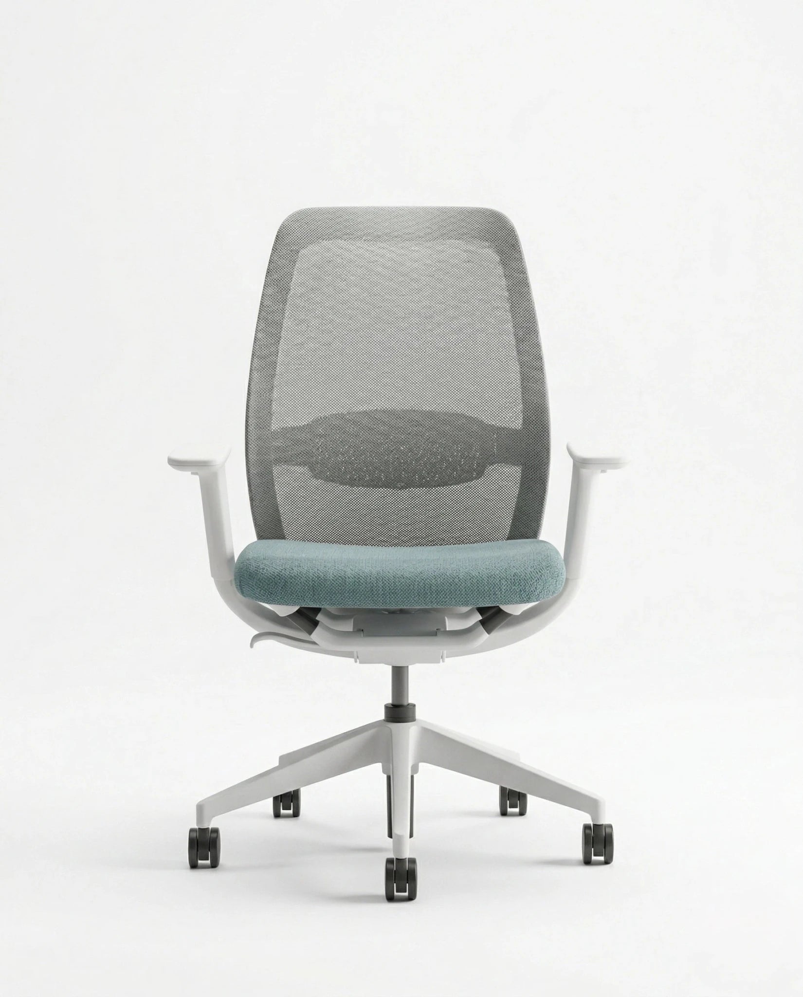 Modern desk chair with teal seat and premium ergonomic mesh office chair by Arris Concepts Luxury Pvt. Ltd.