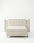 Beautiful cream fluted upholstered bed and premium extended headboard bed crafted by Arris Concepts Luxury Pvt. Ltd.