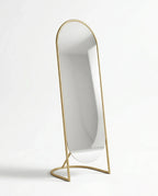 A premium gold floor mirror with an elegant capsule design from Arris Concepts Luxury Pvt. Ltd.