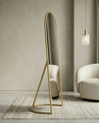 A premium gold floor mirror with an elegant capsule design from Arris Concepts Luxury Pvt. Ltd.