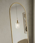 A premium gold floor mirror with an elegant capsule design from Arris Concepts Luxury Pvt. Ltd.