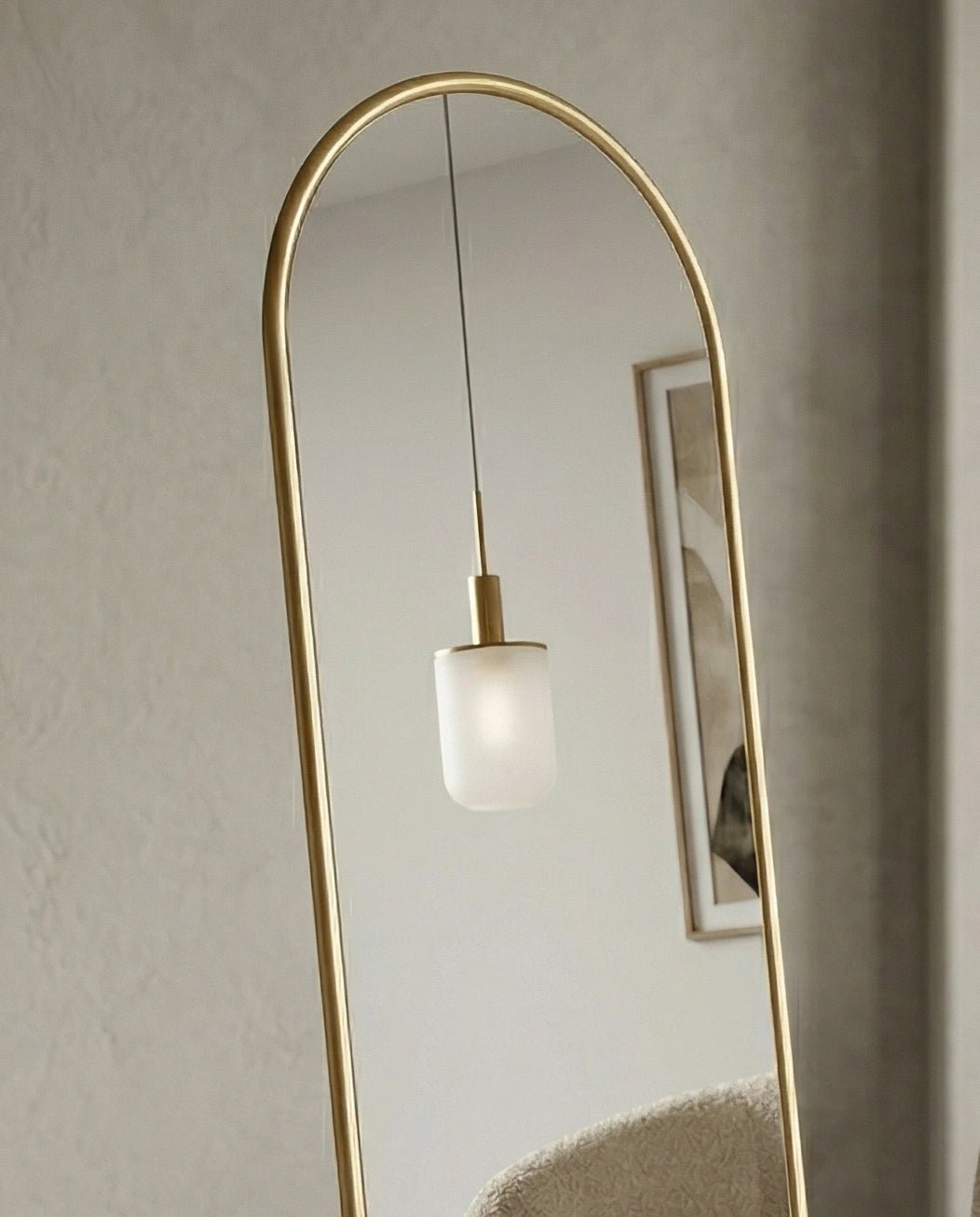 A premium gold floor mirror with an elegant capsule design from Arris Concepts Luxury Pvt. Ltd.