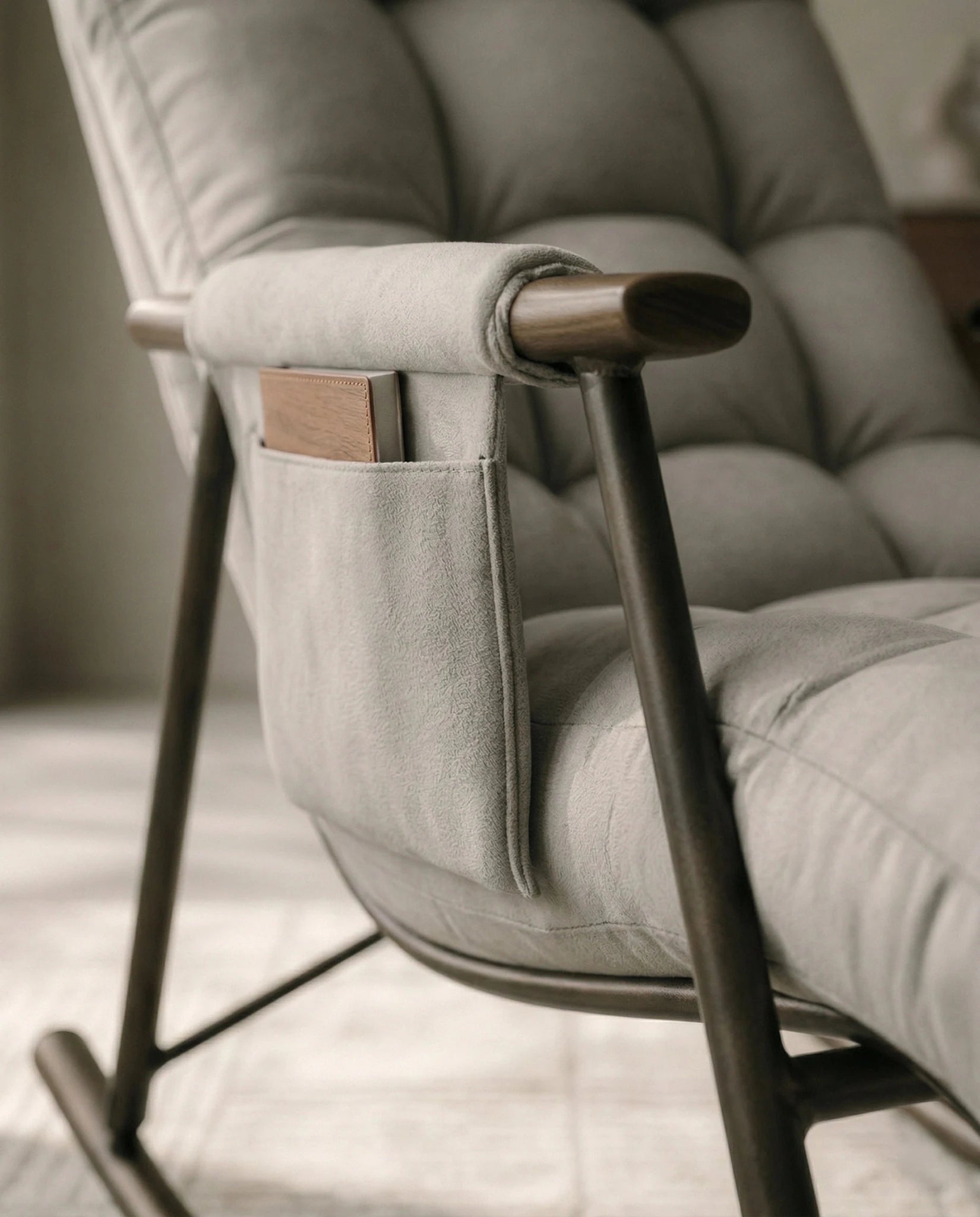 High-end living room seating and premium grey modern rocking chair crafted by Arris Concepts Luxury Pvt. Ltd.