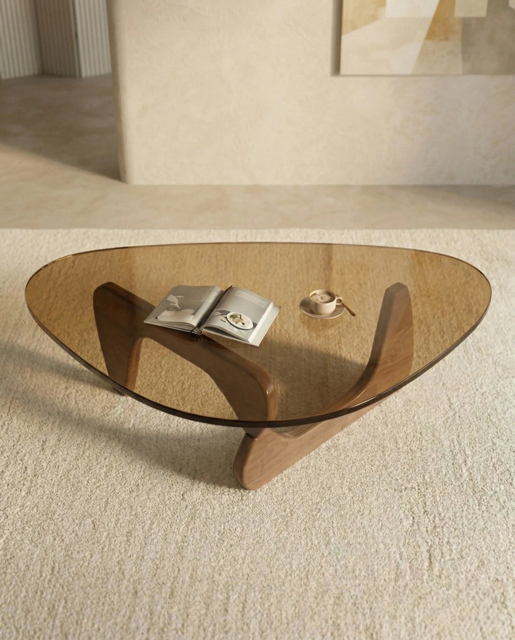 A premium tinted glass coffee table with a modern mid century center table base by Arris Concepts Luxury Pvt. Ltd.
