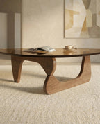 A premium tinted glass coffee table with a modern mid century center table base by Arris Concepts Luxury Pvt. Ltd.