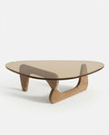 A premium tinted glass coffee table with a modern mid century center table base by Arris Concepts Luxury Pvt. Ltd.