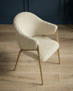Modern designer seating and premium white leather dining chair by Arris Concepts Luxury Pvt. Ltd.