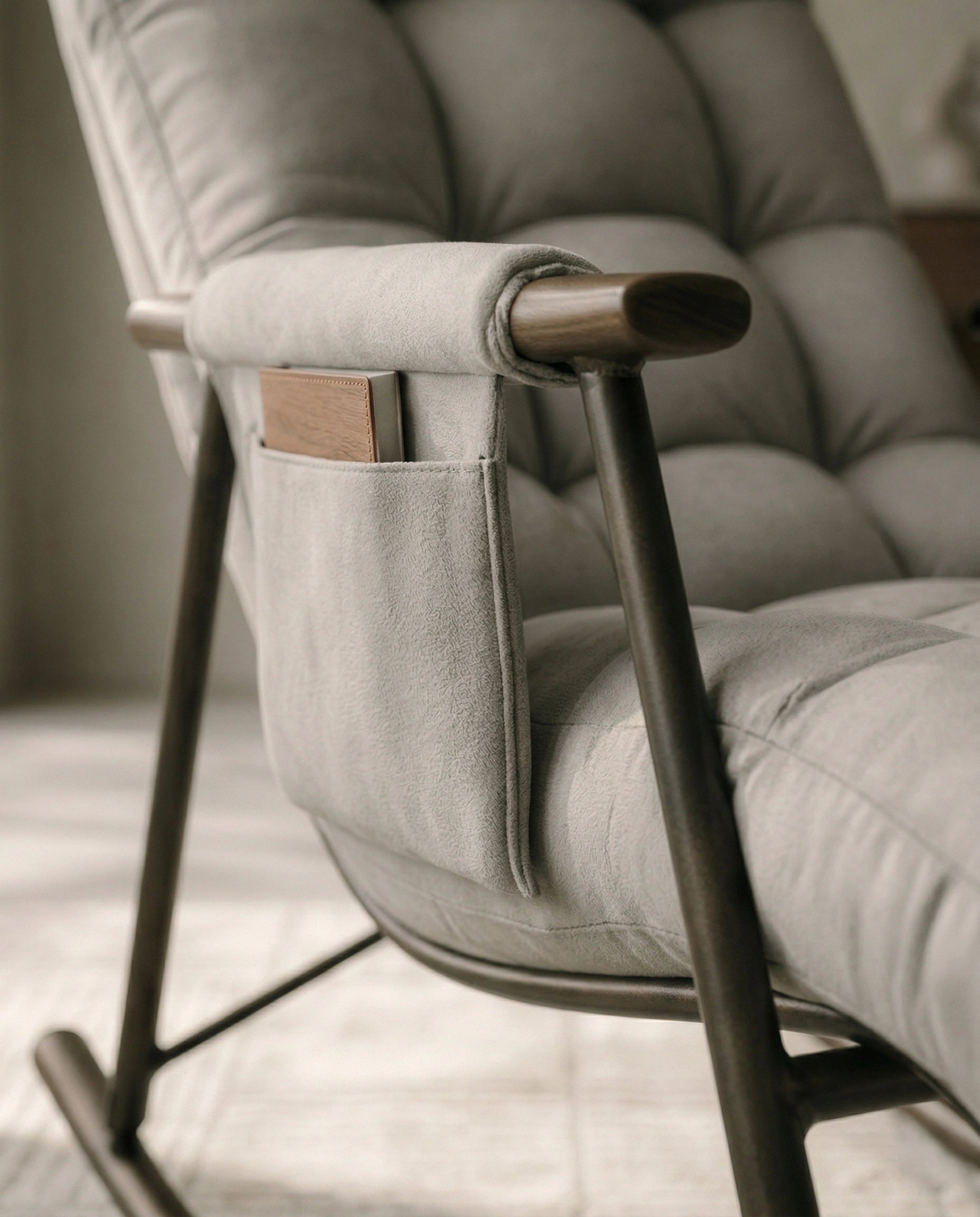 High-end living room seating and premium grey modern rocking chair crafted by Arris Concepts Luxury Pvt. Ltd.