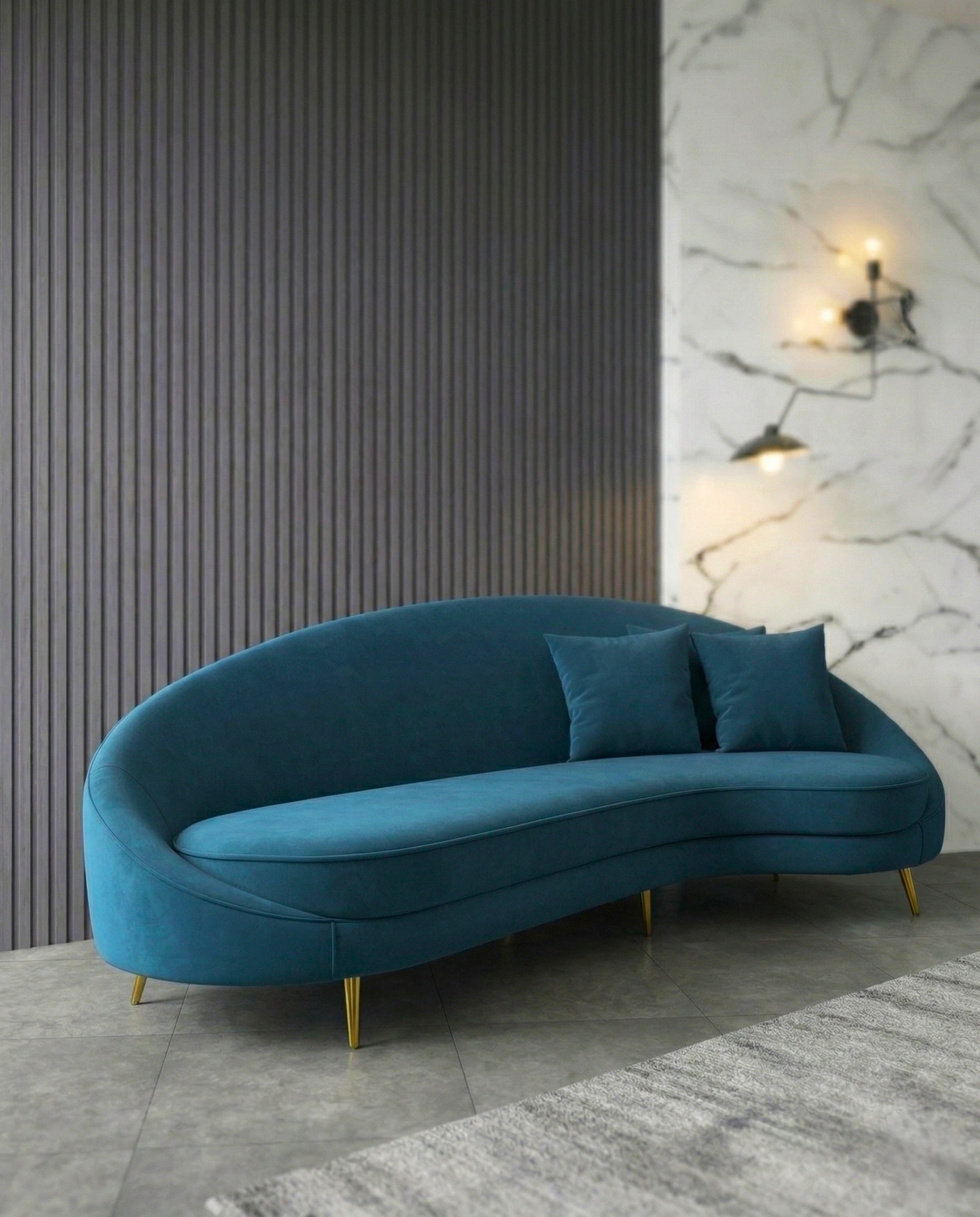 Beautiful premium curved teal velvet sofa crafted by Arris Concepts Luxury Pvt. Ltd.
