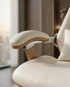 A white leather and wood office chair and modern executive desk chair by Arris Concepts Luxury Pvt. Ltd.