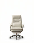 A white leather reclining office chair and modern executive desk chair by Arris Concepts Luxury Pvt. Ltd.