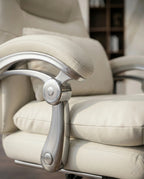 A white leather reclining office chair and modern executive desk chair by Arris Concepts Luxury Pvt. Ltd.