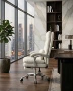 A white leather reclining office chair and modern executive desk chair by Arris Concepts Luxury Pvt. Ltd.