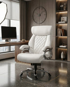 A white tufted executive desk chair and designer white home office seating by Arris Concepts Luxury Pvt. Ltd.