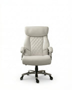 A white tufted executive desk chair and designer white home office seating by Arris Concepts Luxury Pvt. Ltd.