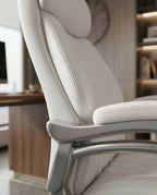 A white tufted executive desk chair and designer white home office seating by Arris Concepts Luxury Pvt. Ltd.